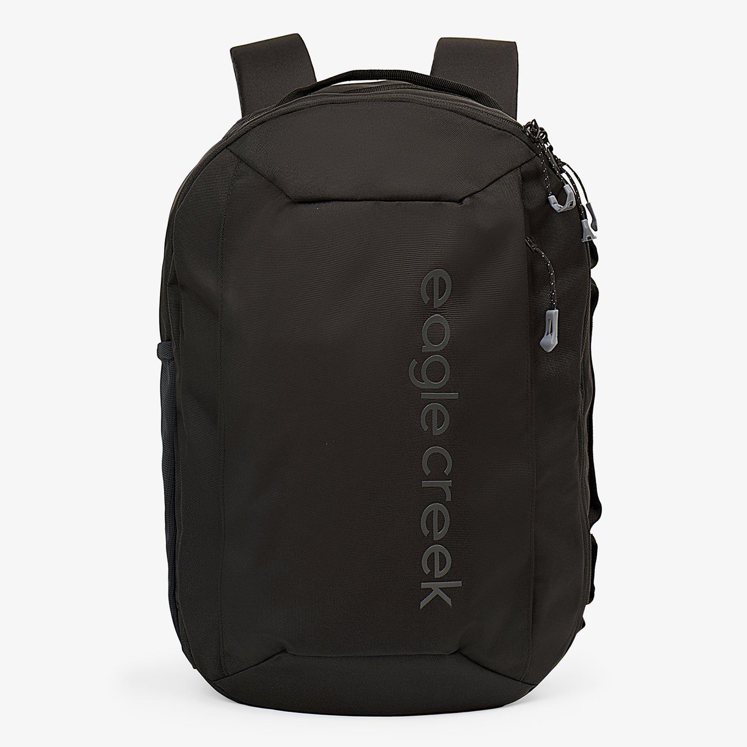 Three different types of travel backpacks lined up on a wooden studio floor.