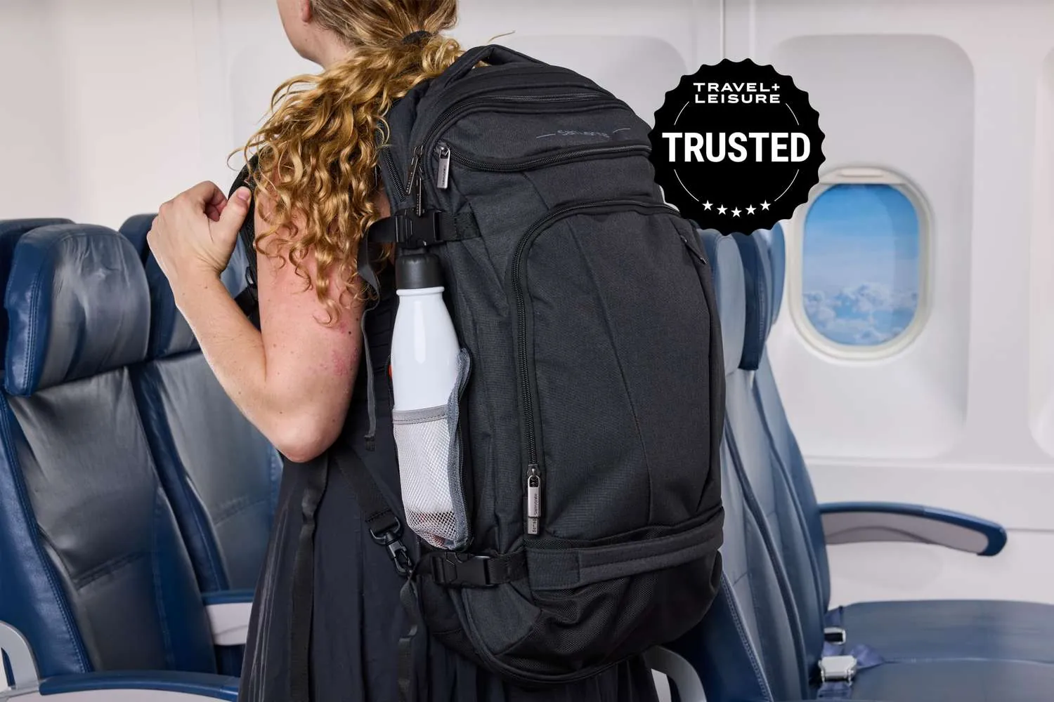 A backpack and carry-on bag neatly placed together in a quiet airport lounge.
