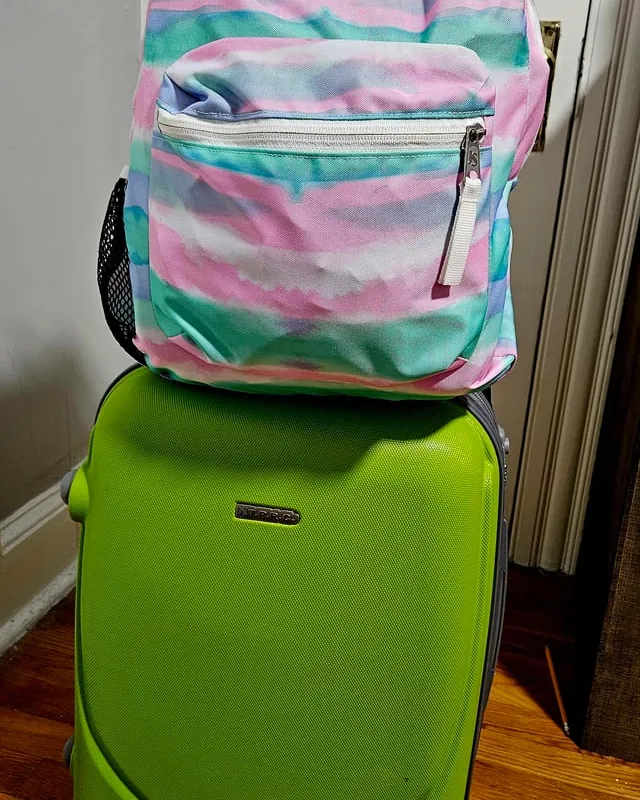 A backpack fits perfectly under the airplane seat during air travel.