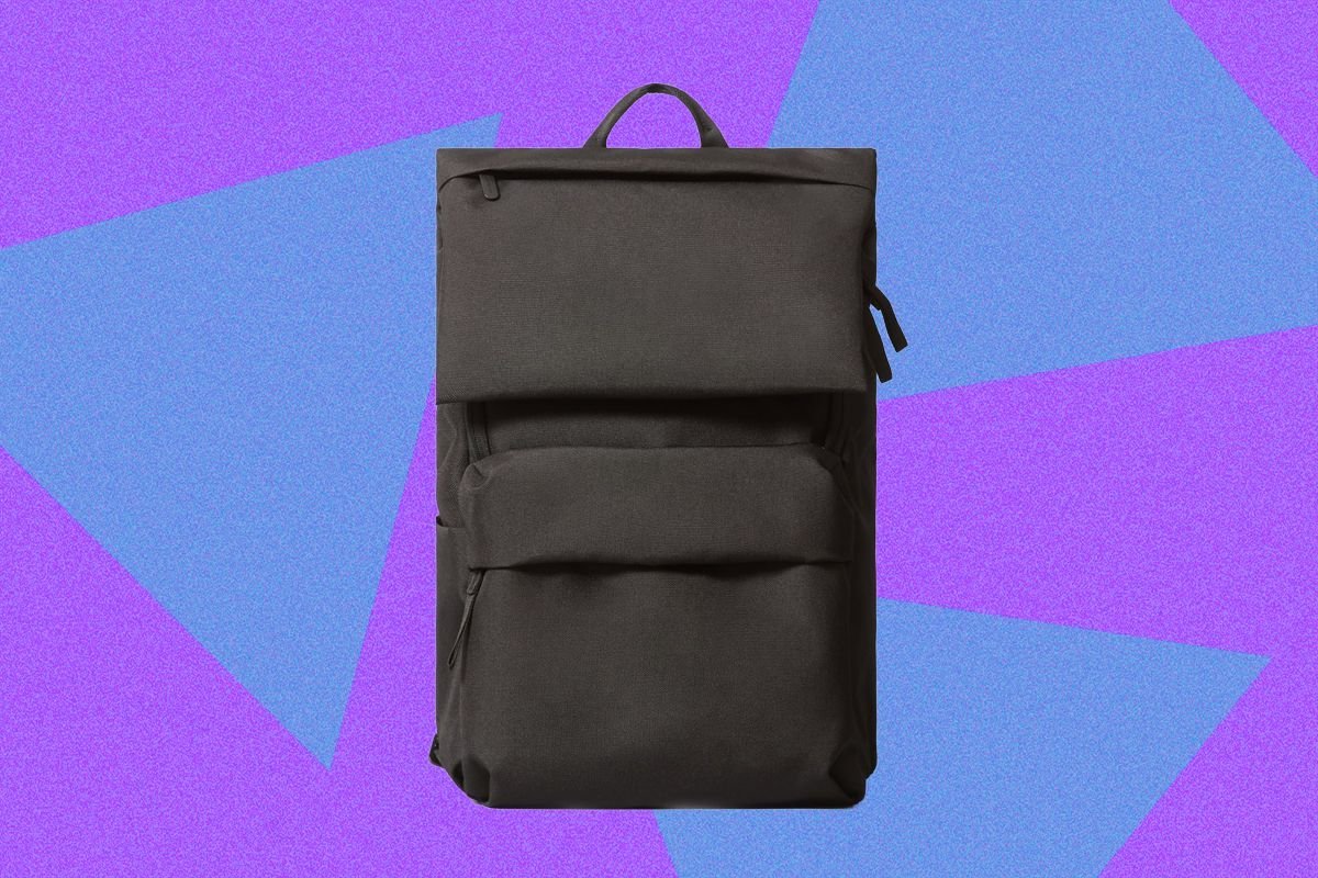 A person showing signs of discomfort and poor posture while wearing a poorly fitted backpack.