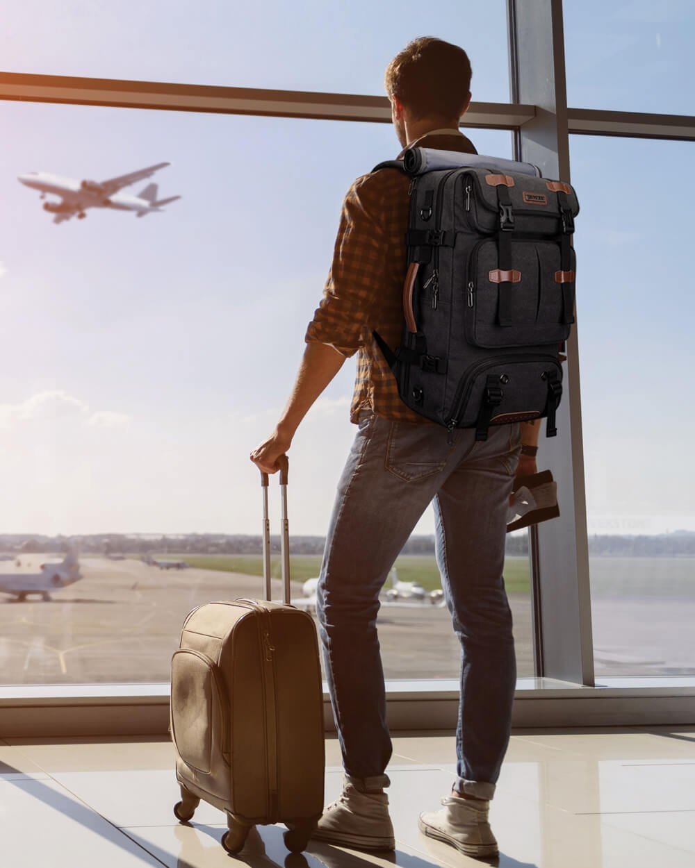 A traveler speaking with airline staff at the gate regarding luggage requirements.