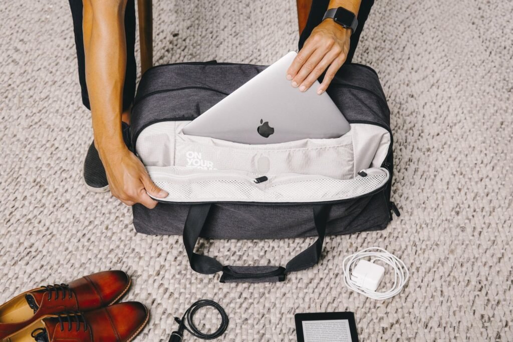 A neatly organized backpack showing how to carry a laptop safely.