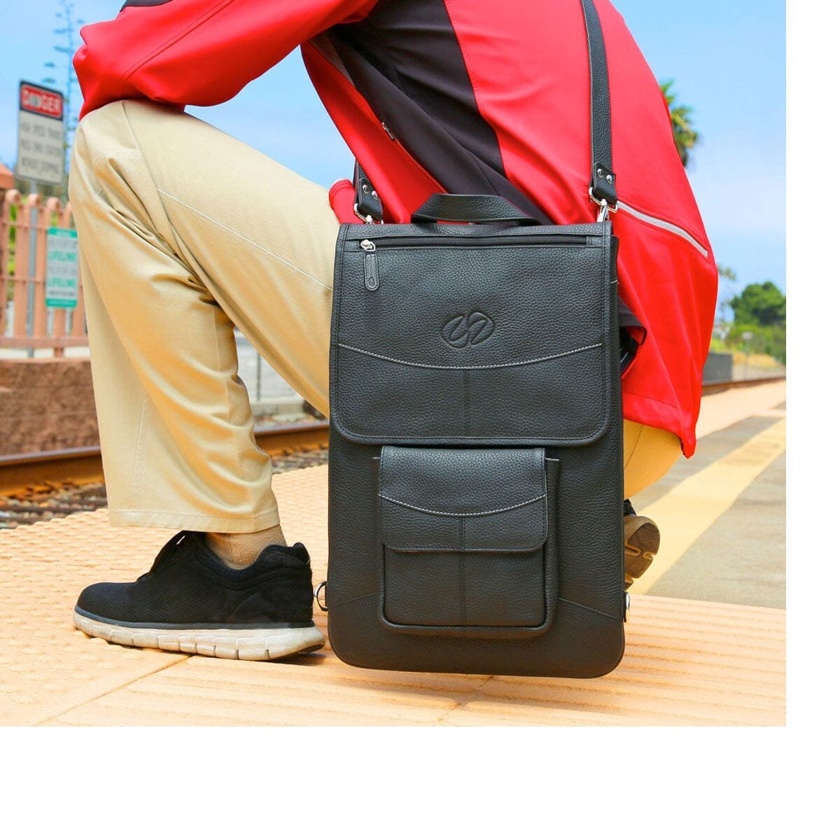 An organized backpack and accessories displayed on a desk for tech questions.