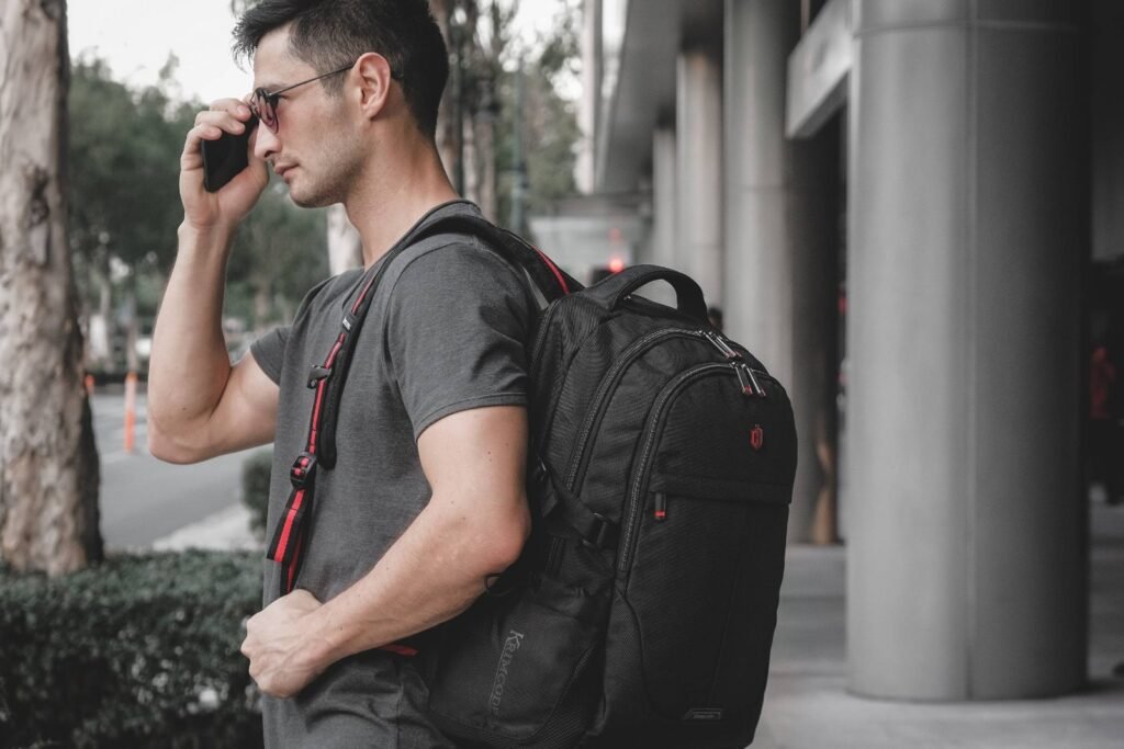 A stylish everyday backpack resting on a wooden bench in a city park.