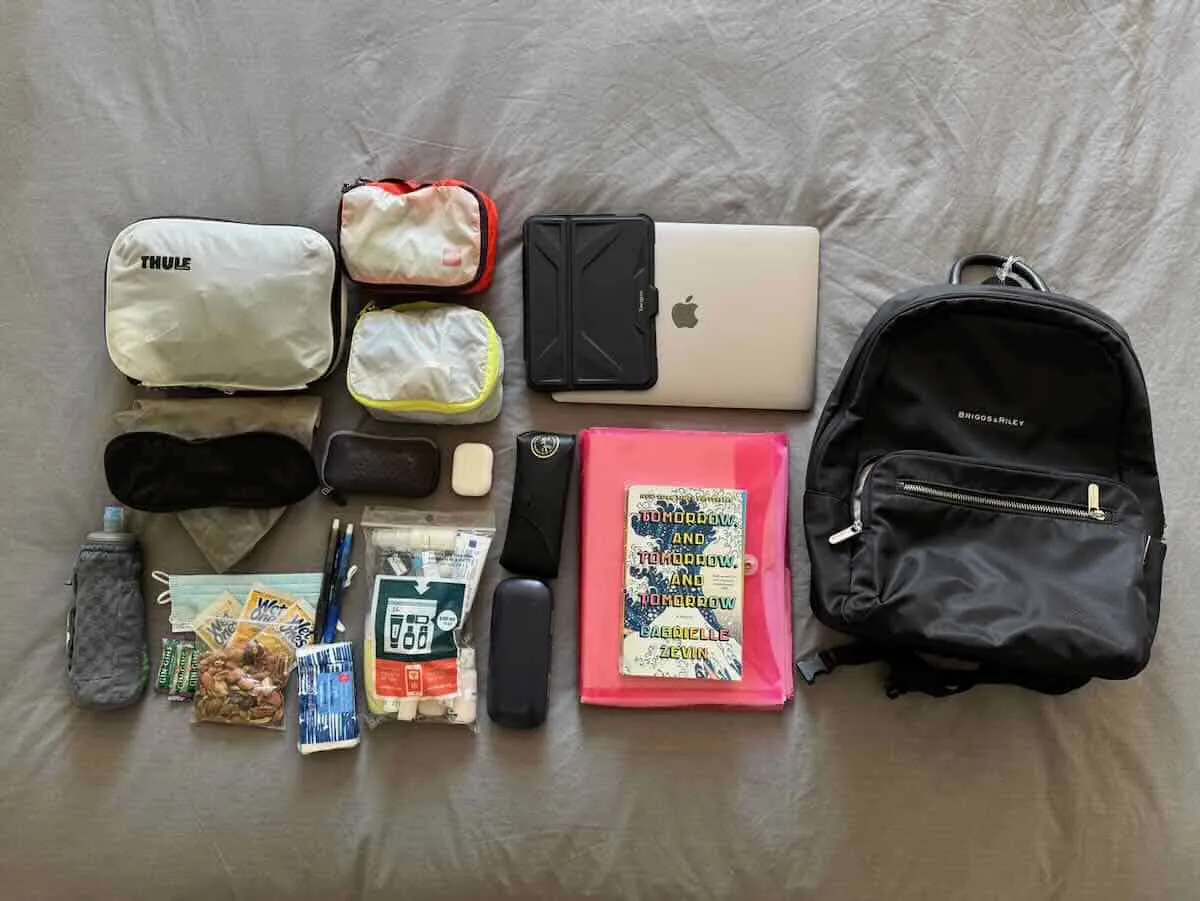 A traveler measuring a fully packed backpack to ensure it meets carry-on limits.