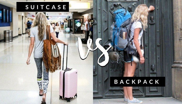 A traveler prepared for a flight with a carry-on suitcase and a backpack.