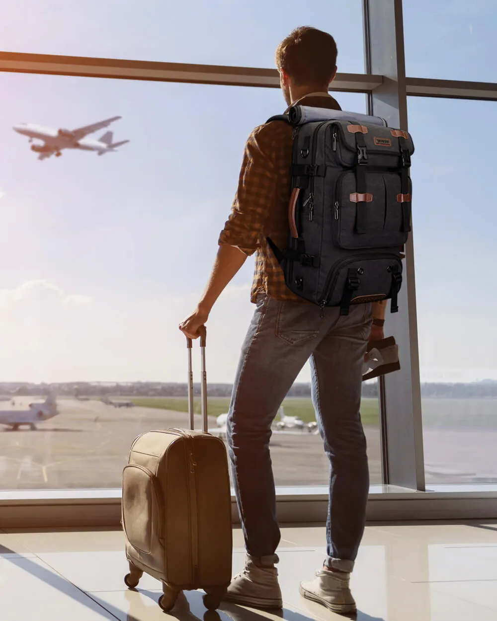 Traveler relaxing in an airport lounge with their luggage packed and ready.