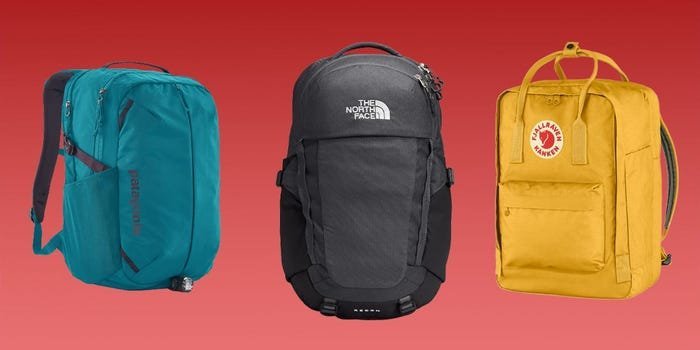 A student comparing different backpack models while shopping for college gear in a store.