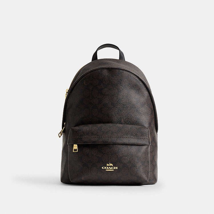 A small backpack sits on a cafe chair ready for a daily outing.
