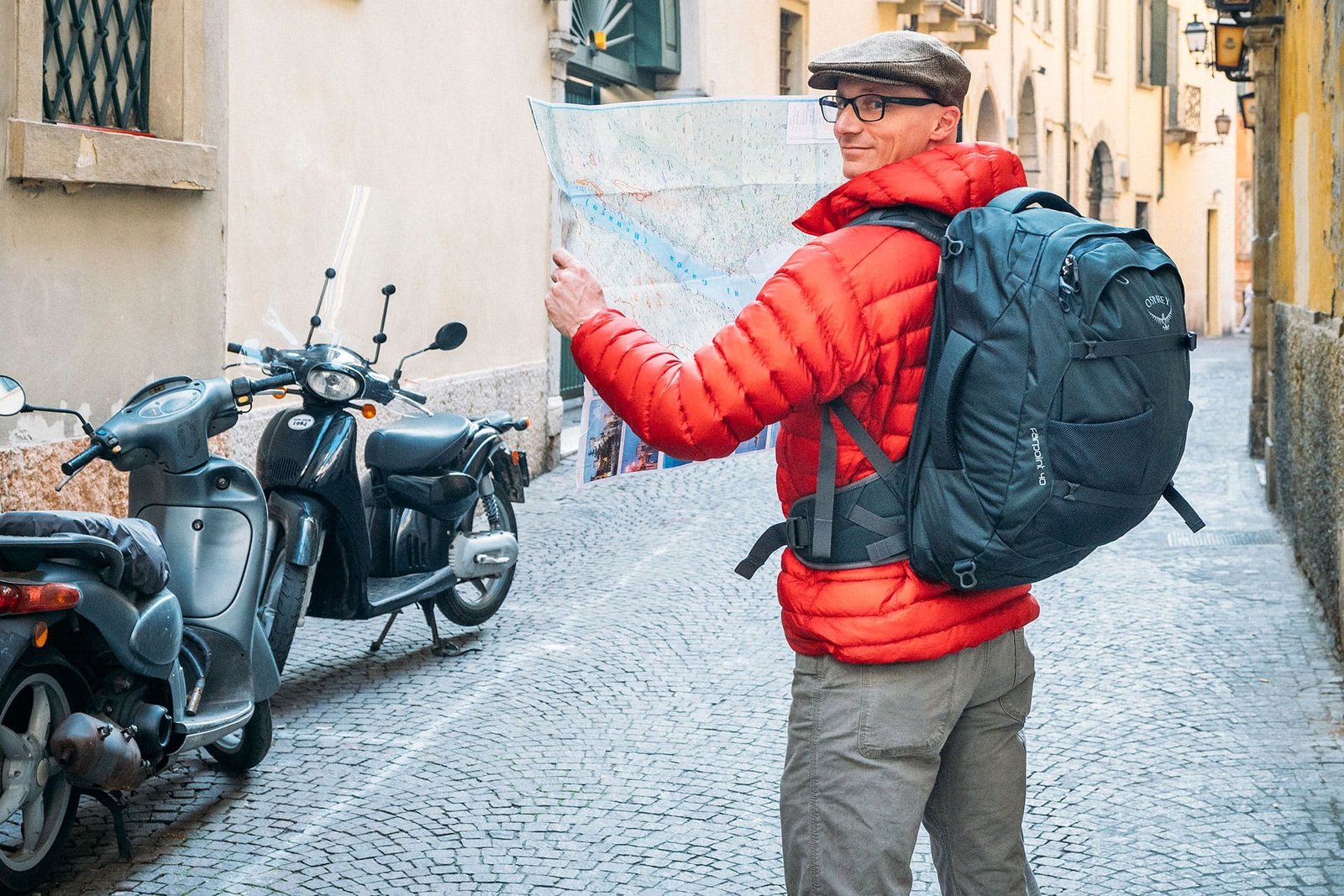 A travel backpack resting near a desk, perfect for planning upcoming travel logistics.