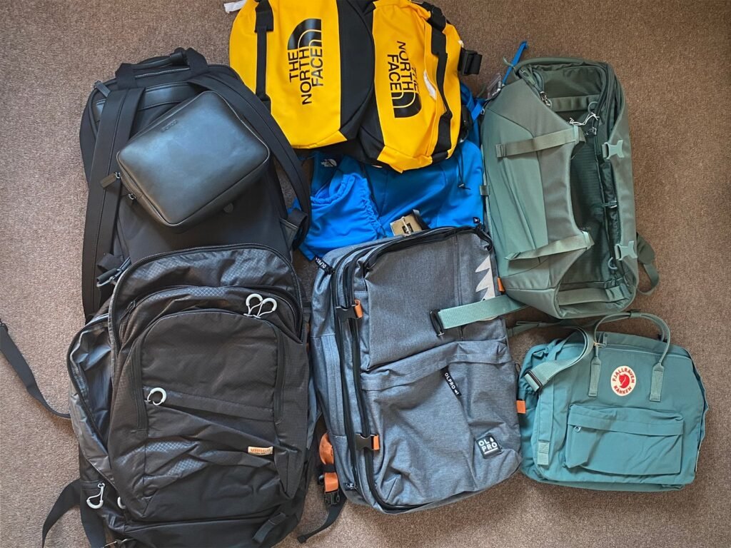 A modern small travel backpack sits on a station bench, ready for a trip.