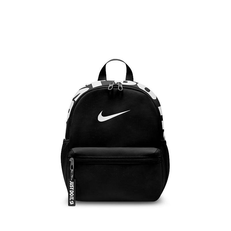 Closing the zipper of a properly packed mini backpack without any visible strain.