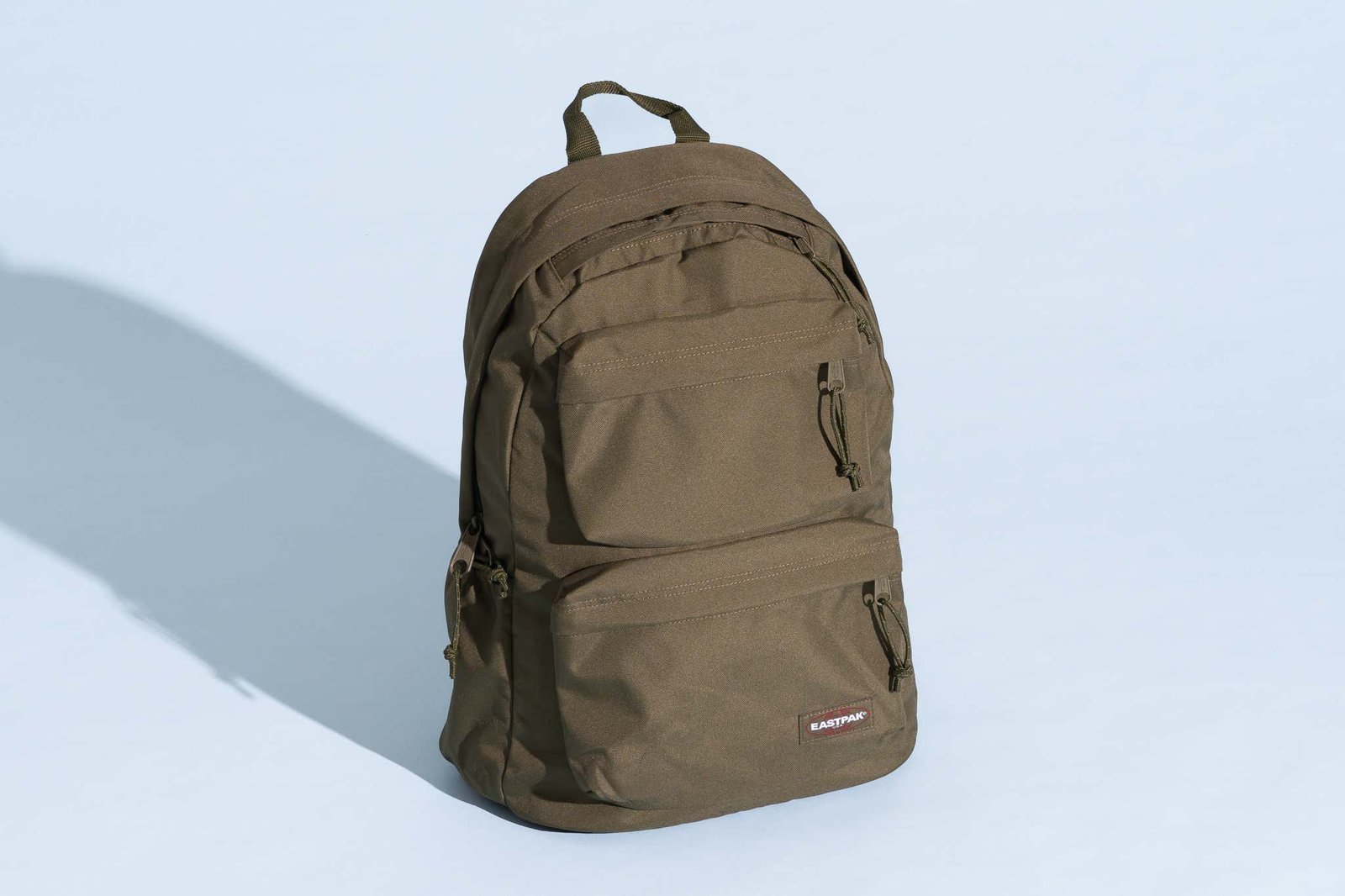 Close up of reinforced stitching and durable zippers on a high quality backpack.