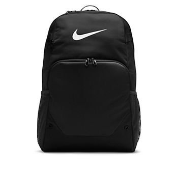 Rows of diverse backpacks displayed on shelves inside a modern retail sporting goods store.