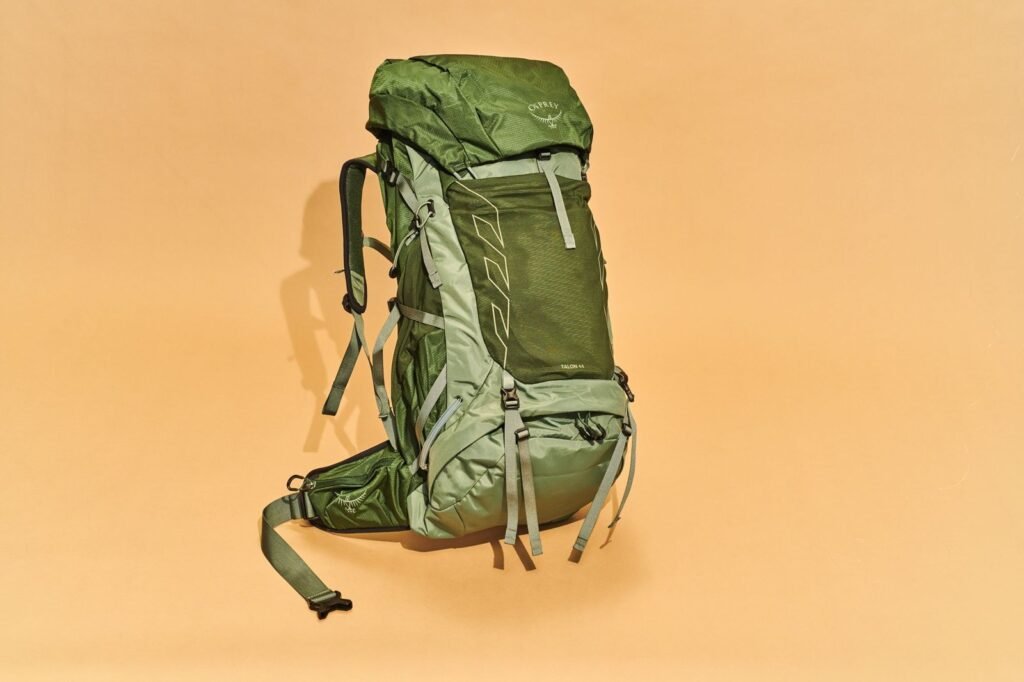 A durable hiking backpack displayed in a bright and modern retail store.
