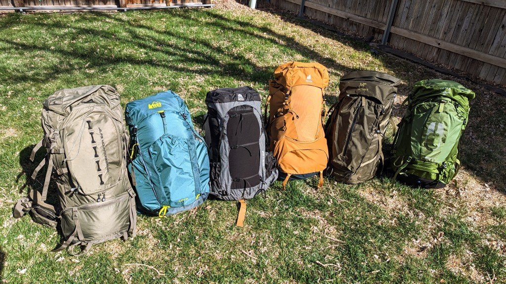 A durable hiking backpack rests on a mountain ledge, representing the best travel backpack for hiking.
