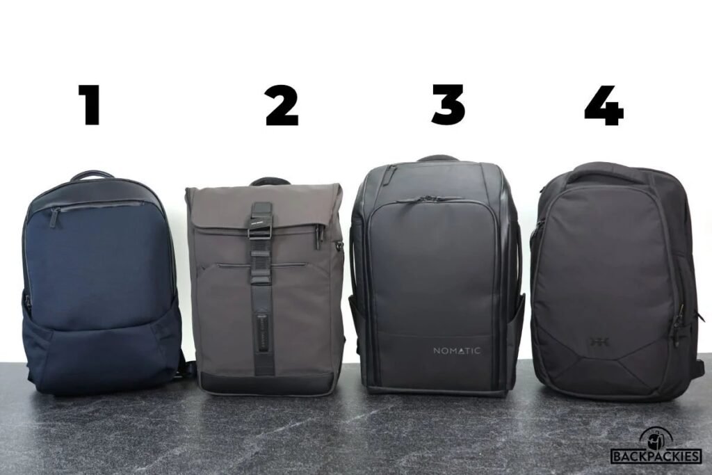 A modern travel backpack for men sits on a table in a bright airport.
